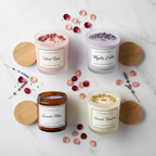Scented & Spiritual Candle Quad - top-down flat lay of all four candles with rose petals and lavender on white marble