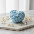 Pastel sky blue heart floral candle on white marble - Just Natural Purity