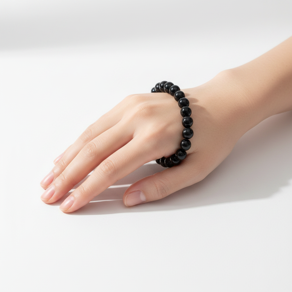 Model wearing Black Obsidian bead bracelet — premium crystal bracelet for protection and grounding