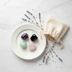 Intuition & Psychic Crystal Set - top-down flat lay of Amethyst, Obsidian, Rose Quartz and Green Aventurine tumbles with cotton potli