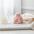 Blush pink angel cherub figurine candle styled on white marble with dried flowers and crystal - Just Natural Purity