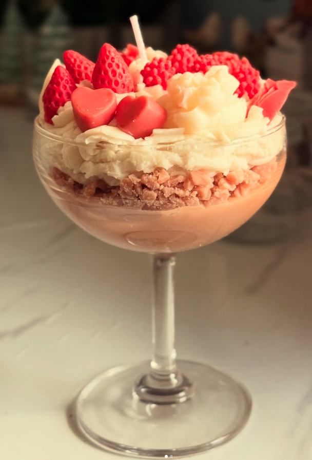 Strawberry sundae dessert candle in clear coupe glass — real product photo