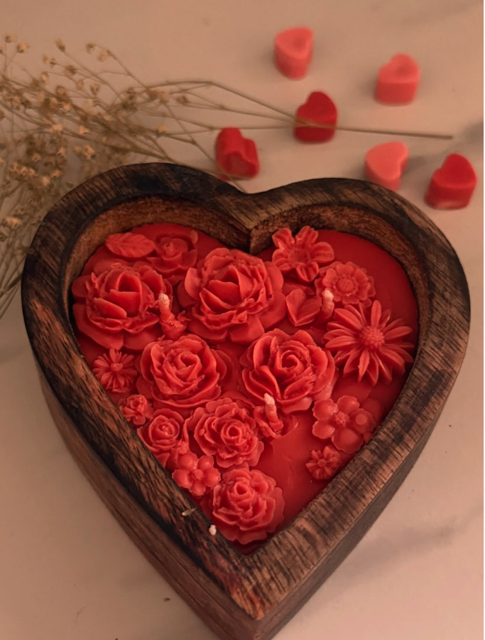 Heart-shaped wooden tray filled with red rose wax candles — real product photo