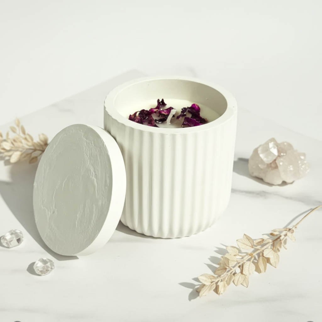Rose petal jar candle styled flat lay on white marble with crystals and botanicals
