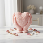 Pastel blush pink heart holding candle on white marble with dried rose petals - Just Natural Purity