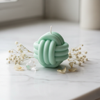 Pastel mint green infinity bloom candle on white marble - Just Natural Purity