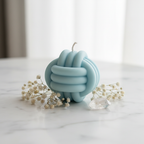 Pastel sky blue infinity bloom candle on white marble - Just Natural Purity