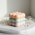 Triple cloud bubble cube candle with pastel peach mint and pink layers on white marble - Just Natural Purity