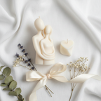 Two Hearts One Flame candle gift set - top down flat lay with flowers and ribbon
