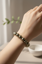 Pyrite Bracelet worn on wrist showing metallic luster and abundance energy