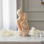 Pastel peach couple hugging figurine soy candle on white marble with dried flowers - Just Natural Purity