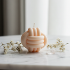 Pastel peach infinity bloom candle on white marble - Just Natural Purity