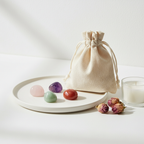 Love & Heart Healing Crystal Set - Rose Quartz, Amethyst, Green Aventurine and Red Carnelian tumbles on white plate with cotton potli