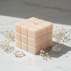Pastel peach dice candle on white marble - Just Natural Purity