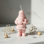 Pastel blush pink Santa Claus figurine candle on white marble - Just Natural Purity