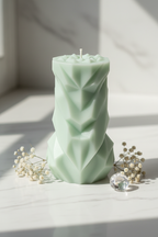 Pastel sage green geometric chevron pillar candle on white marble - Just Natural Purity