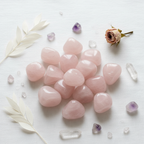 Rose Quartz Tumble 50 gms styled flat lay on white linen with crystals and botanicals