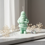 Pastel mint green Santa Claus figurine candle on white marble - Just Natural Purity
