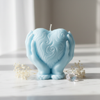 Pastel sky blue heart holding candle on white marble with dried flowers - Just Natural Purity