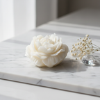 Pure white rose bloom candle on white marble with dried baby's breath flowers - Just Natural Purity