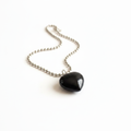 Black Tourmaline heart pendant necklace on silver ball chain — clean white background product shot