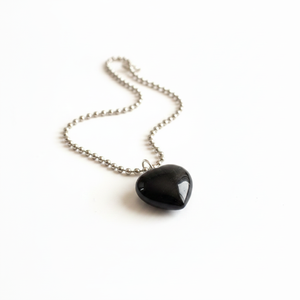 Black Tourmaline heart pendant necklace on silver ball chain — clean white background product shot