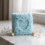 Pastel sky blue Love Pillar rose candle on white marble - Just Natural Purity