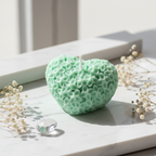 Pastel mint green heart floral candle on white marble - Just Natural Purity