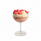 Strawberry sundae dessert candle in coupe glass on pure white background, clean studio shot
