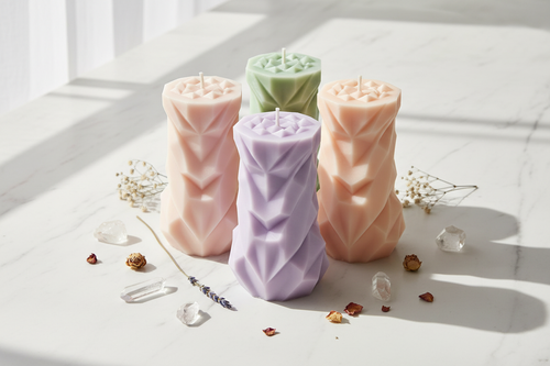 Aesthetic geometric chevron pillar candles in pastel colours group shot on white marble - Just Natural Purity