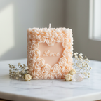 Pastel peach Love Pillar rose candle on white marble - Just Natural Purity